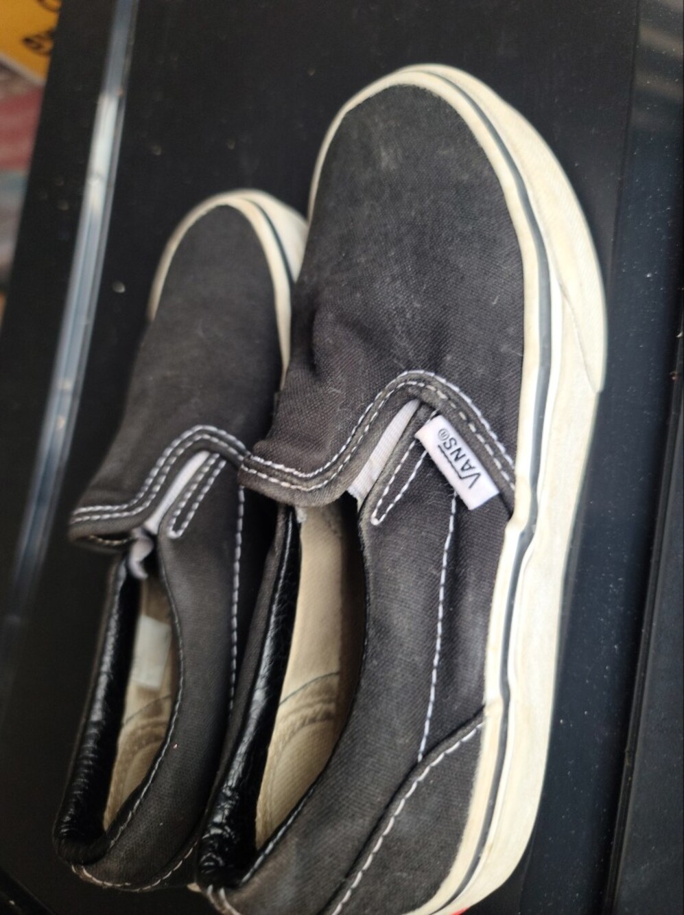 Vans Black and White Slip-On Canvas Sneakers